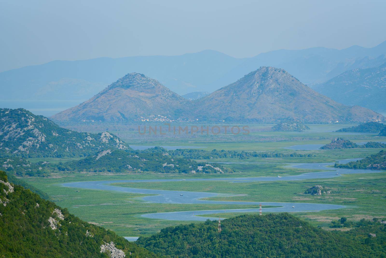 Landscape of winding river Crnojevica and mountains in montenegro. by iceberg