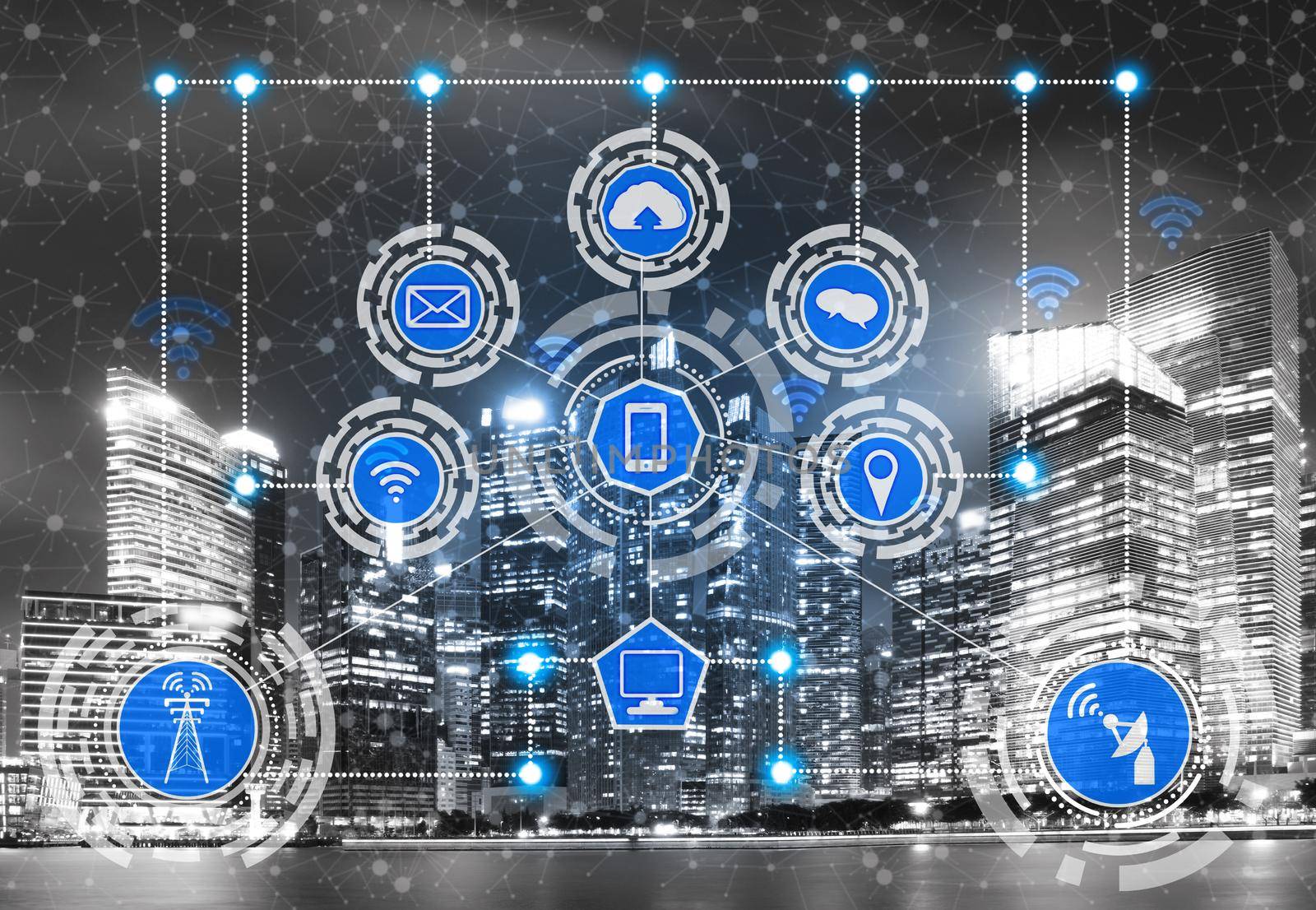 Smart city wireless communication network with graphic showing concept of internet of things ( IOT ) and information communication technology ( ICT ) against modern city buildings in the background.