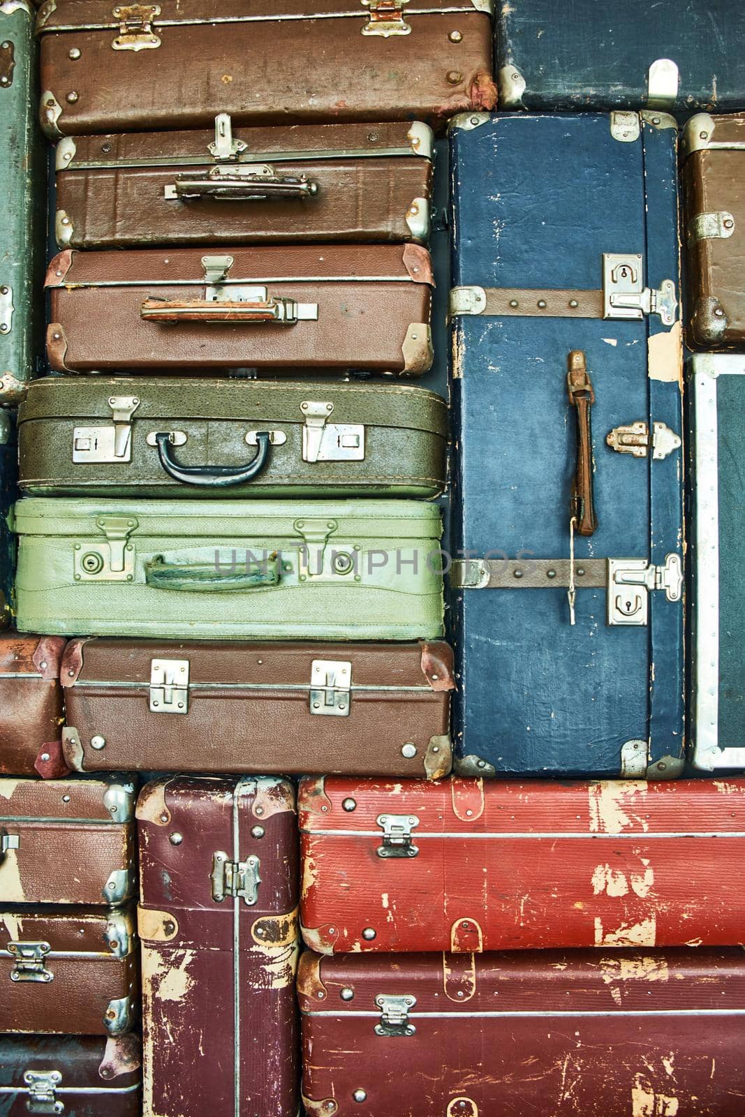 Suitcases for travel. Multicoloured suitcases for clothes. Background. Texture.