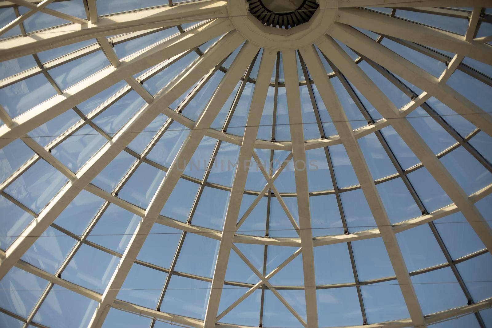 Dome is made of glass. Architecture details. Roof is in shape of sphere. Glazing in building.