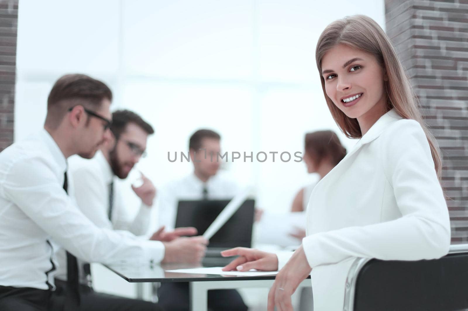 young employee sitting at his Desk in the office by asdf