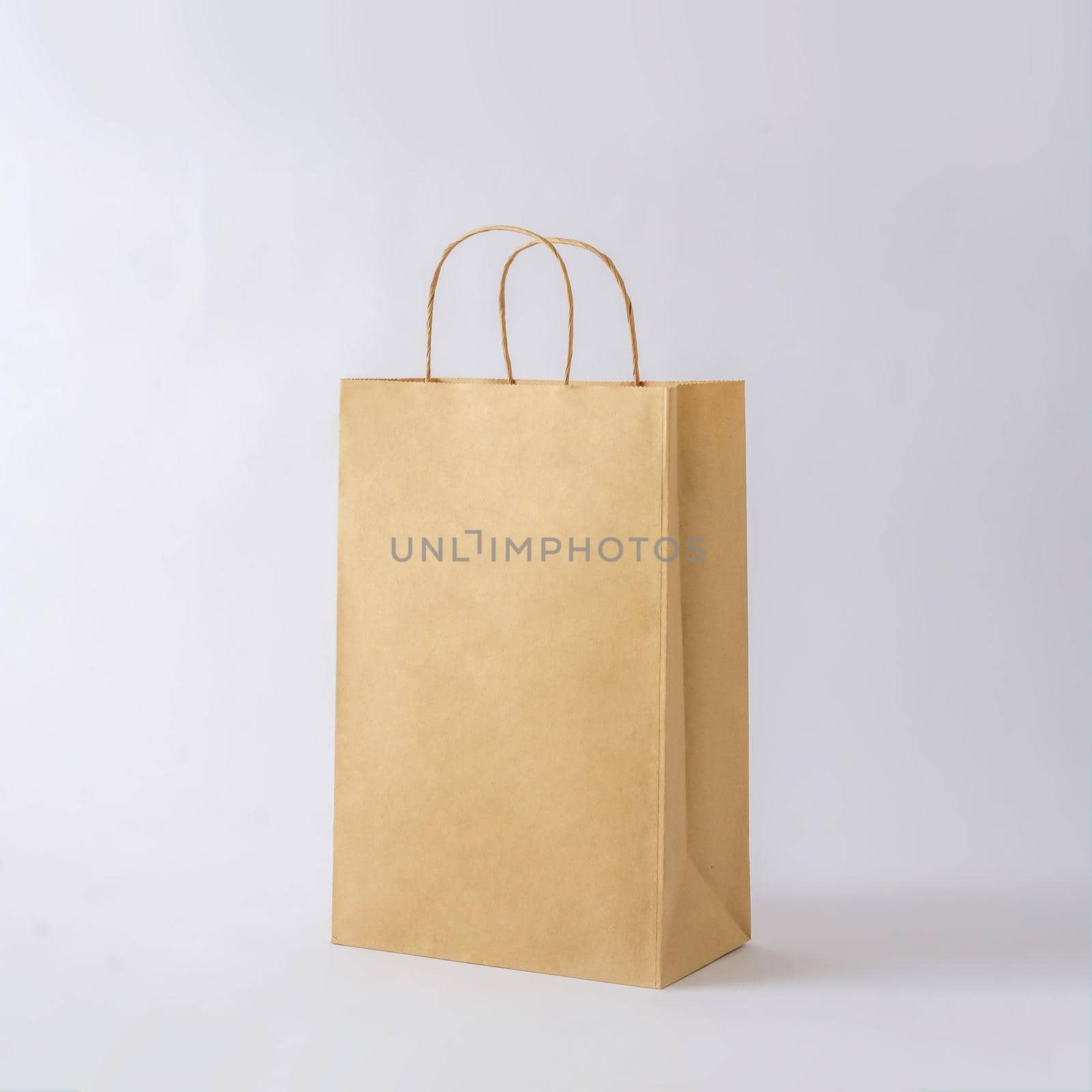 Cardboard brown paper bag for shop shopping and business mockup by sergii_gnatiuk