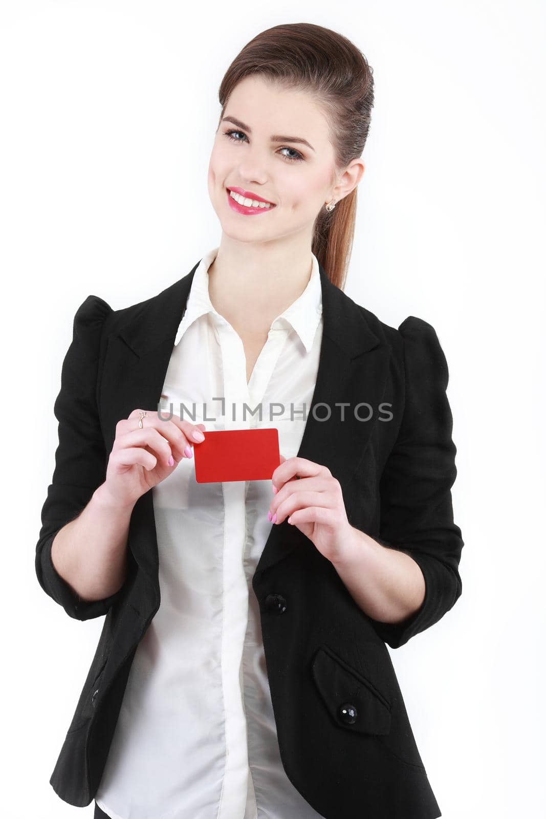 Close-up portrait of young smiling business woman holding credit card isolated on white background