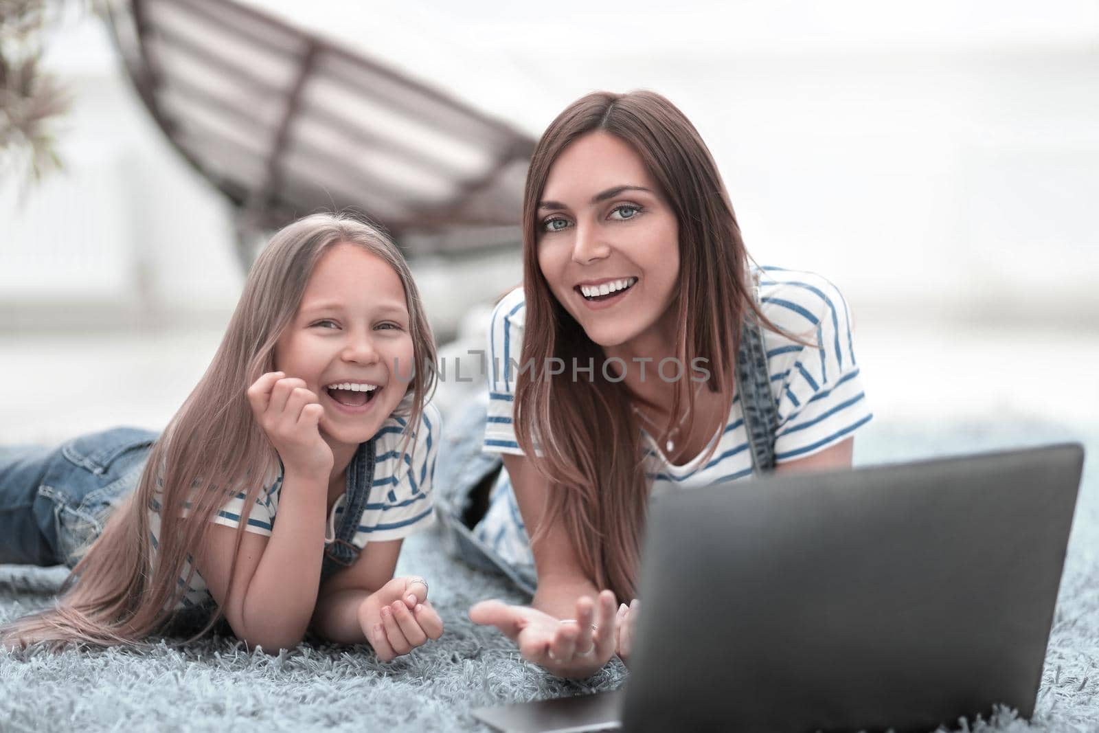 smiling mother and daughter spend their free time together by asdf