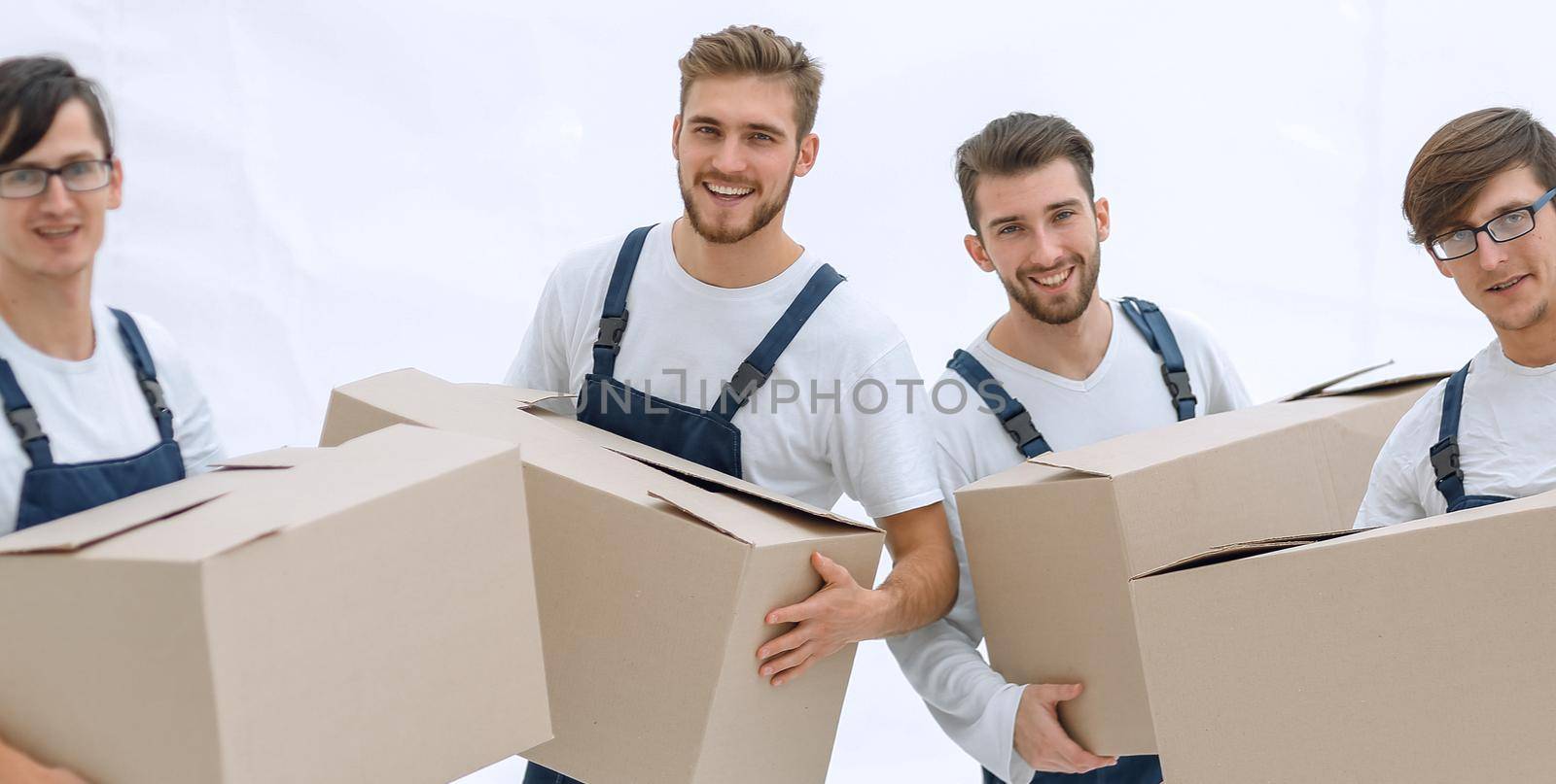 photo workers holding boxes when moving flats, by asdf