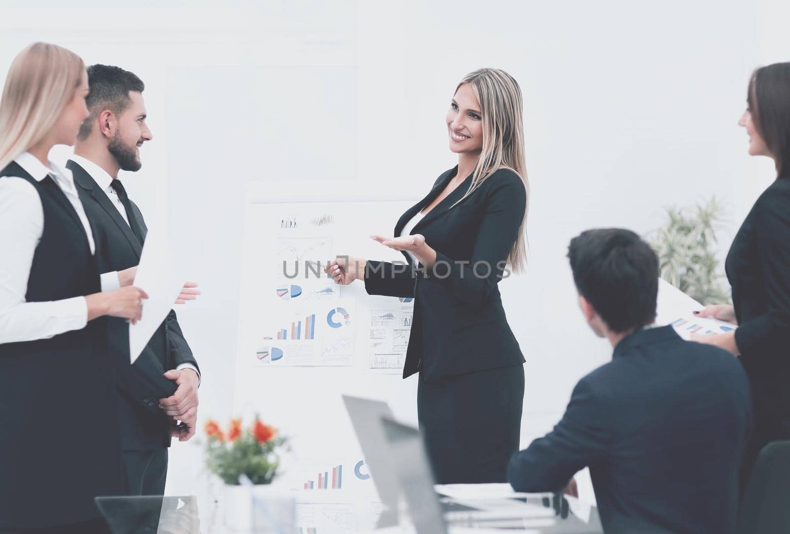 business woman doing a presentation to his business team.photo with copy space