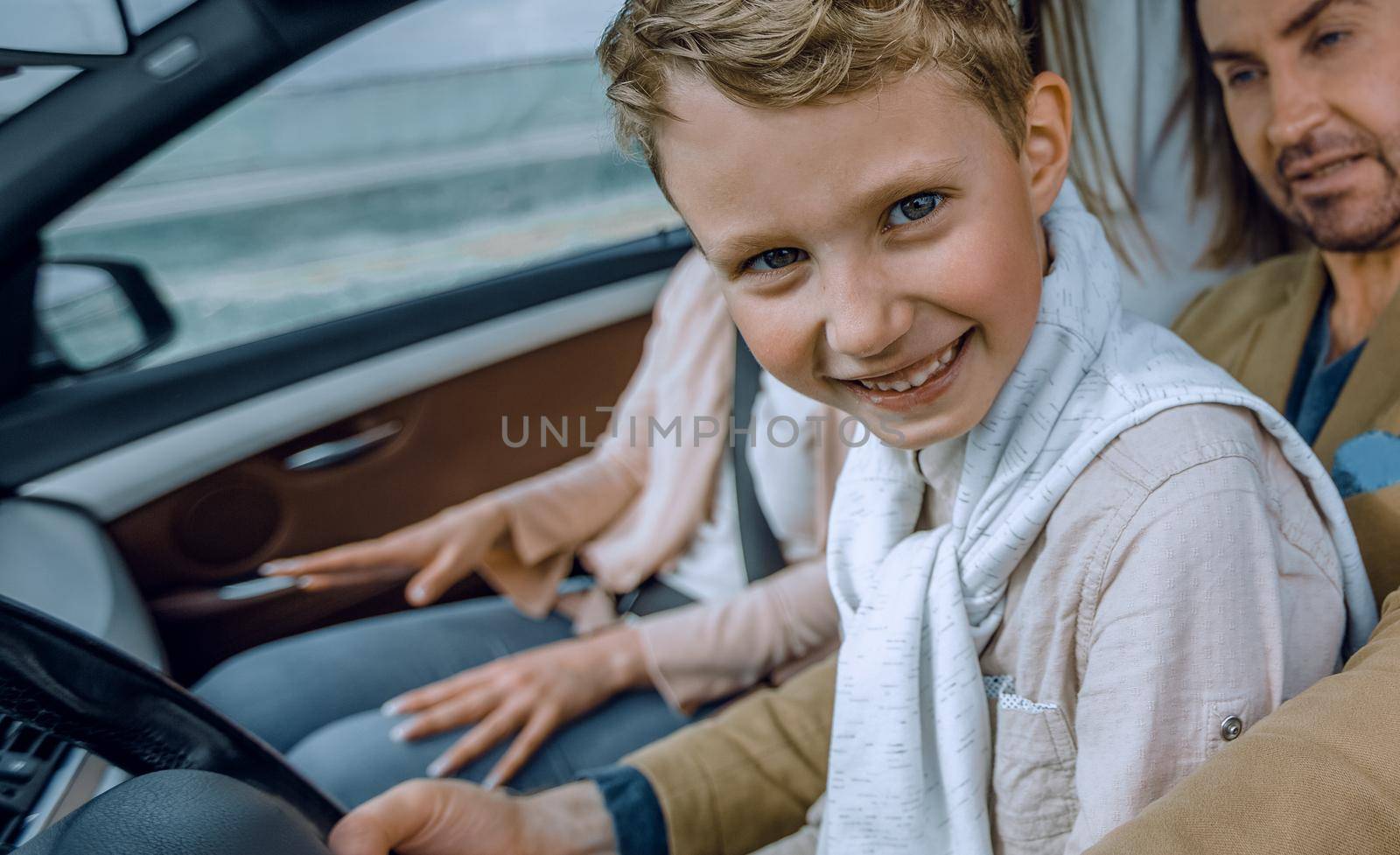 father and son driving a car. family weekend