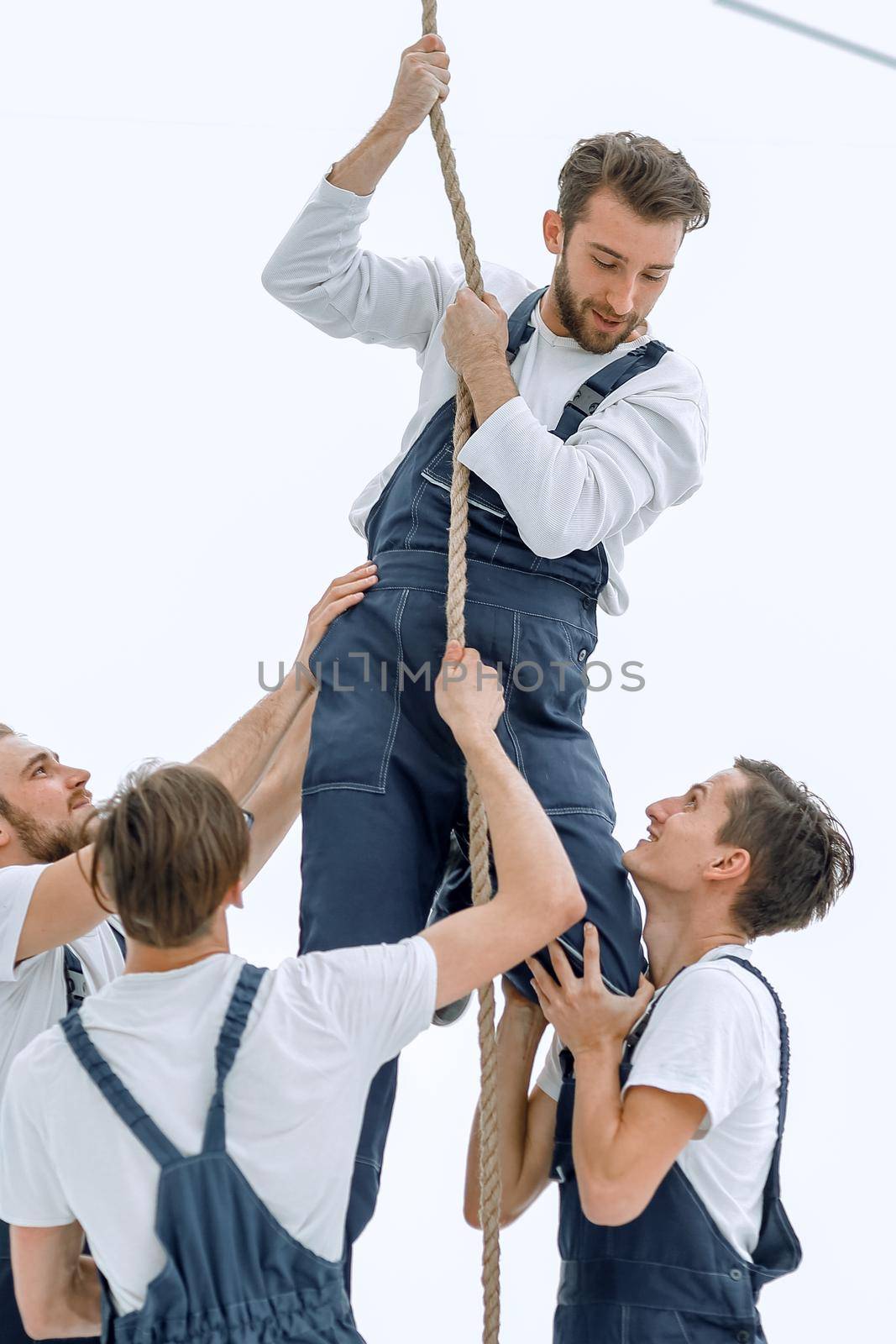 group workers help the companion to climb up by asdf