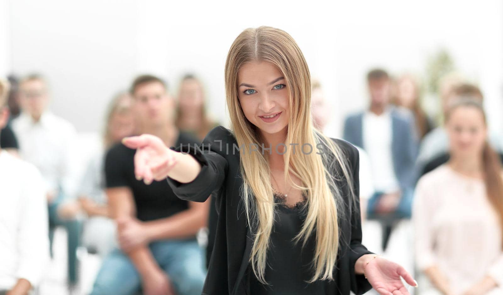 young woman on a blurred background of the auditorium by asdf