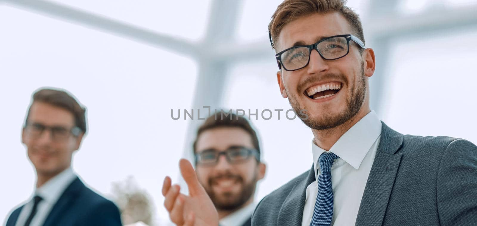 young successful businessman on background of office.photo with copy space
