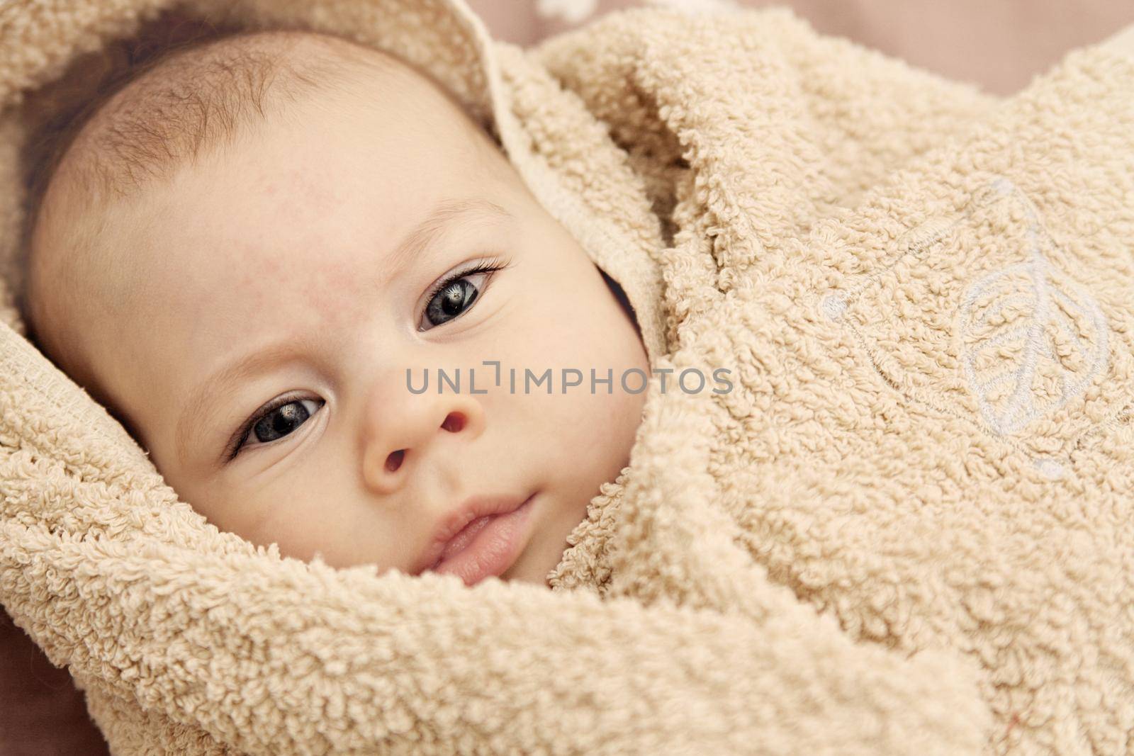 Photo of newborn caucasian child face after bath 
