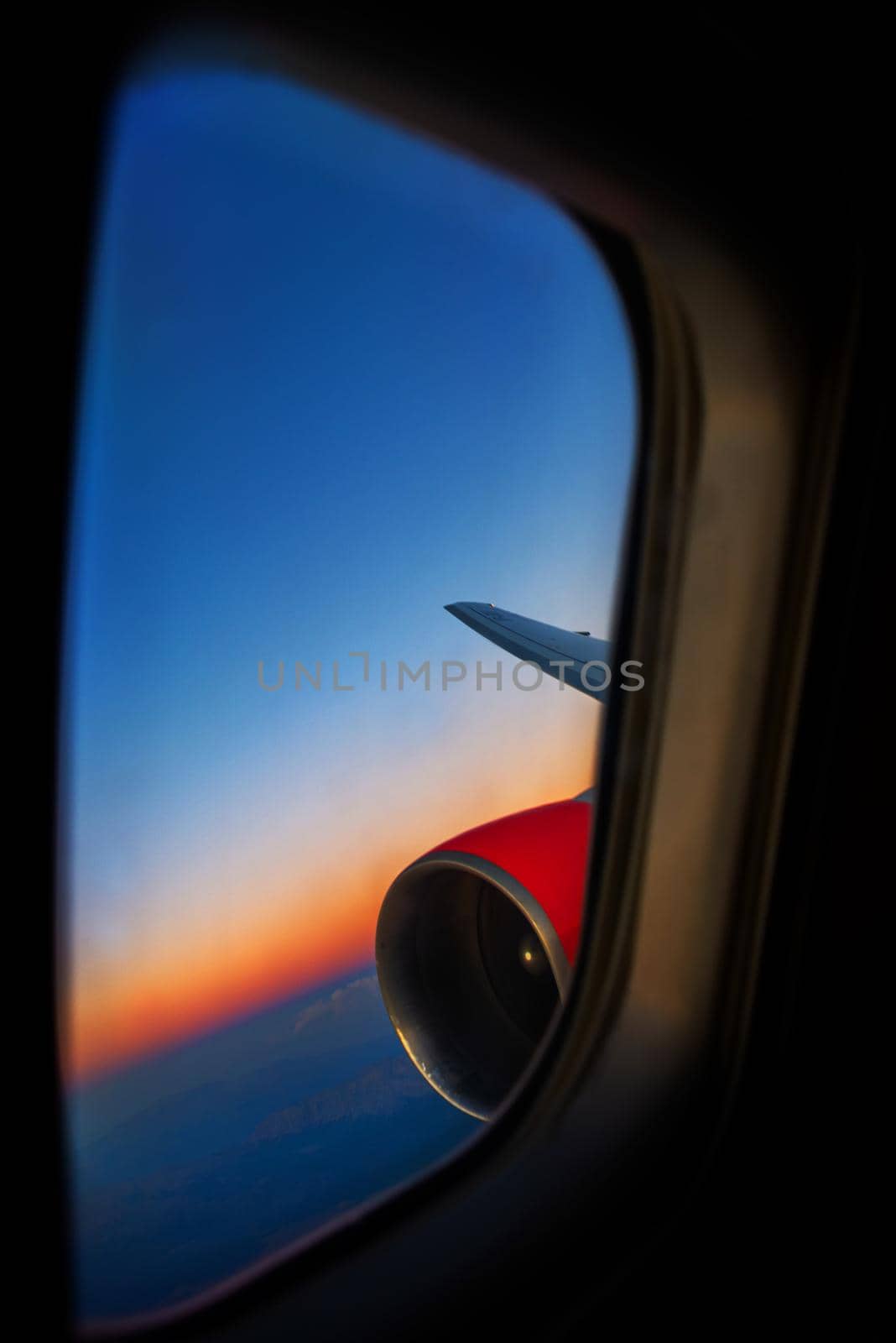 View from a jet plane window high on the blue skies. Beautiful landscape.