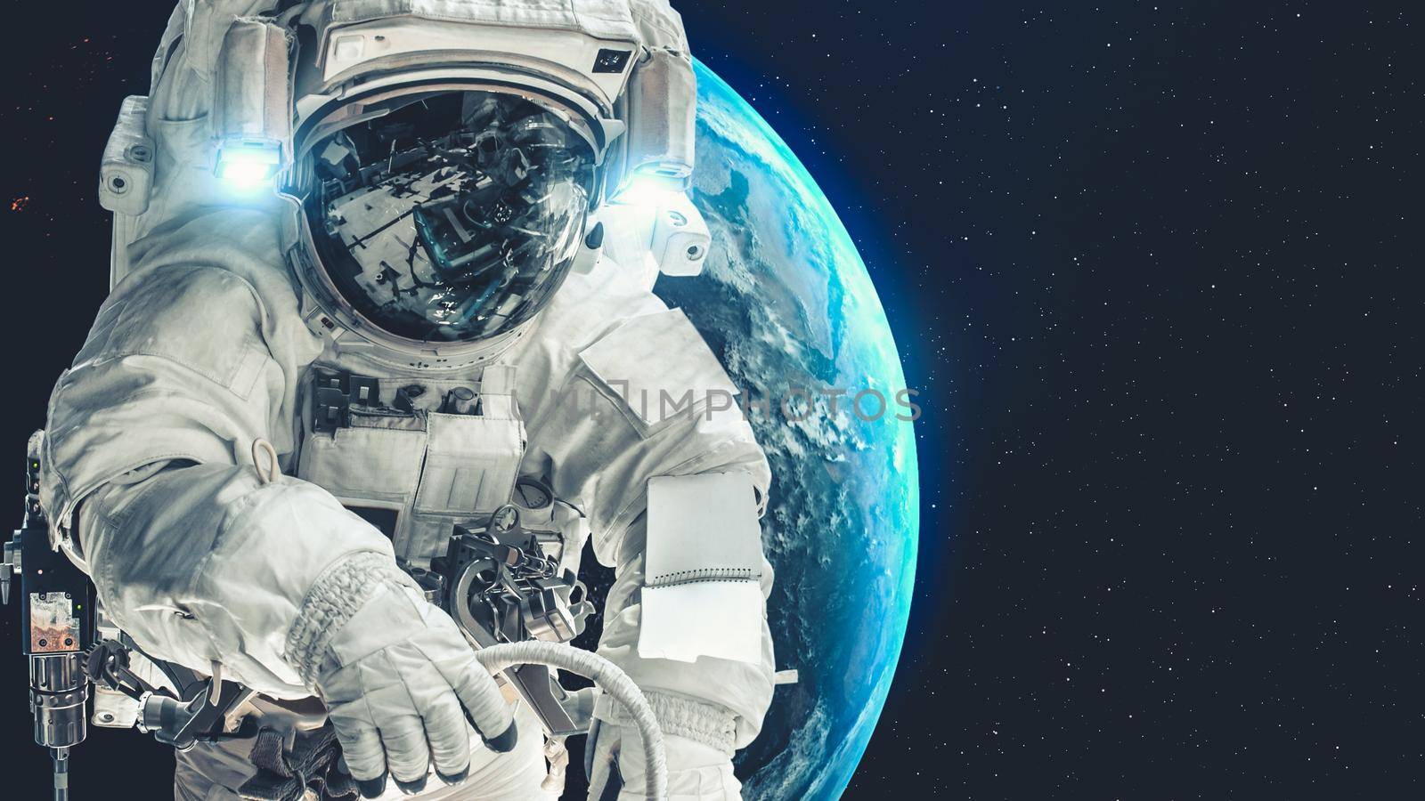 Astronaut spaceman do spacewalk while working for spaceflight mission at space station . Astronaut wear full spacesuit for operation . Elements of this image furnished by NASA space astronaut photos .