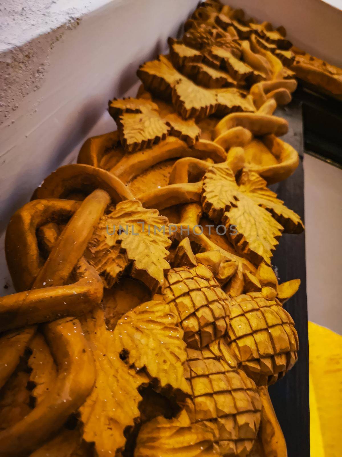 Ornamental wooden decorations over door frame by Wierzchu