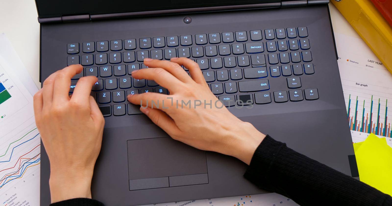 Woman hands typing on laptop, business and finance by RecCameraStock