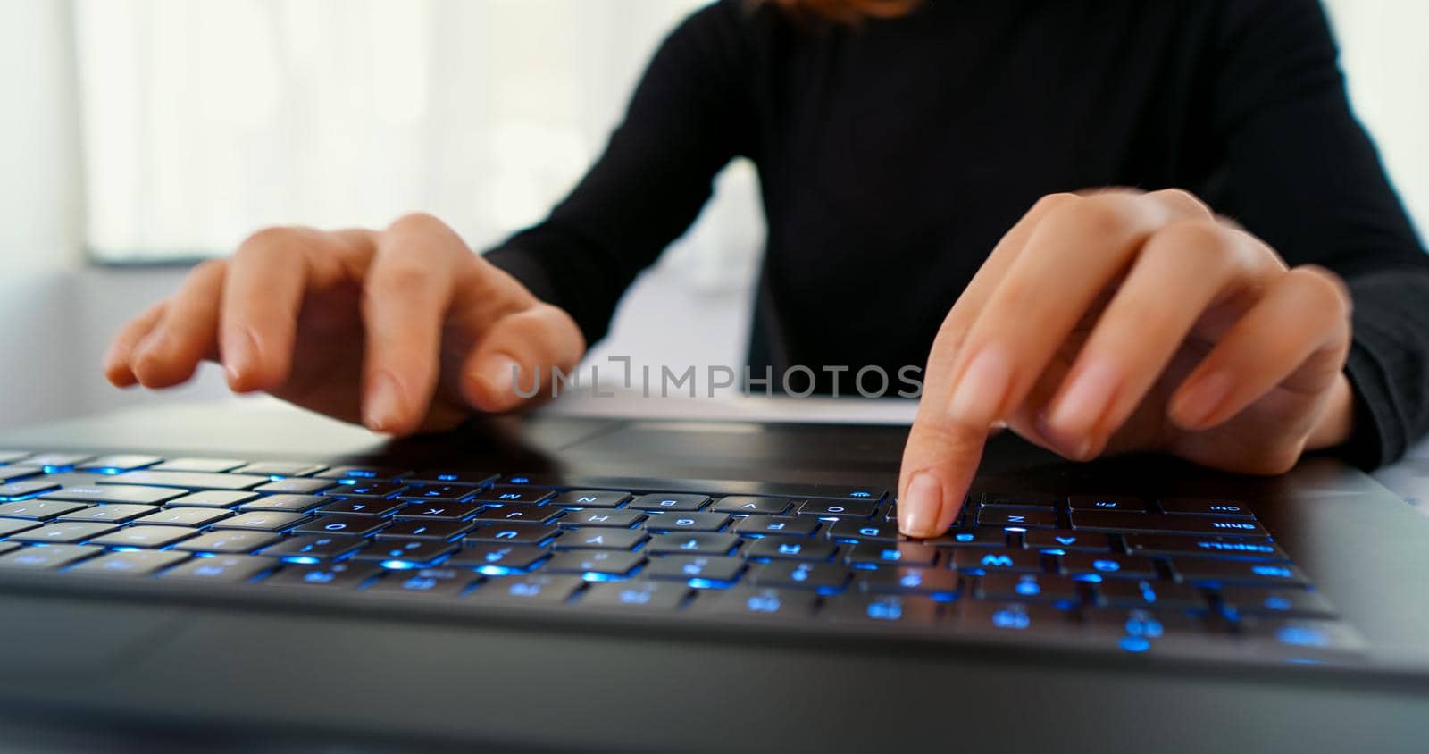 Woman typing on desktop computer keyboard for searching information, marketing research, online communication support, reports. Working online, technology, office work day.