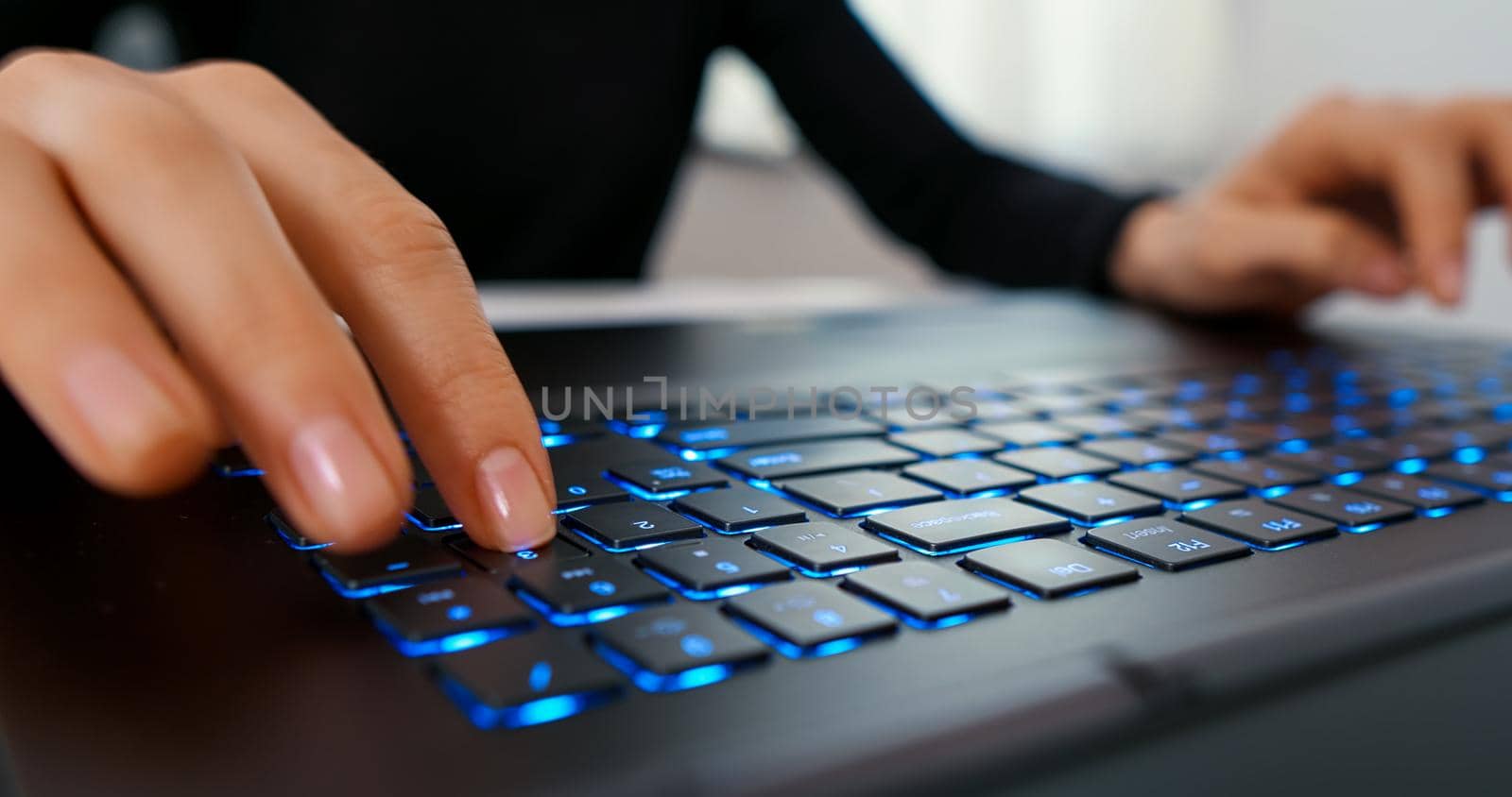 Woman makes calculations on computer keyboard. Accountancy concept. Working online, technology, office work day, business and finance concept.