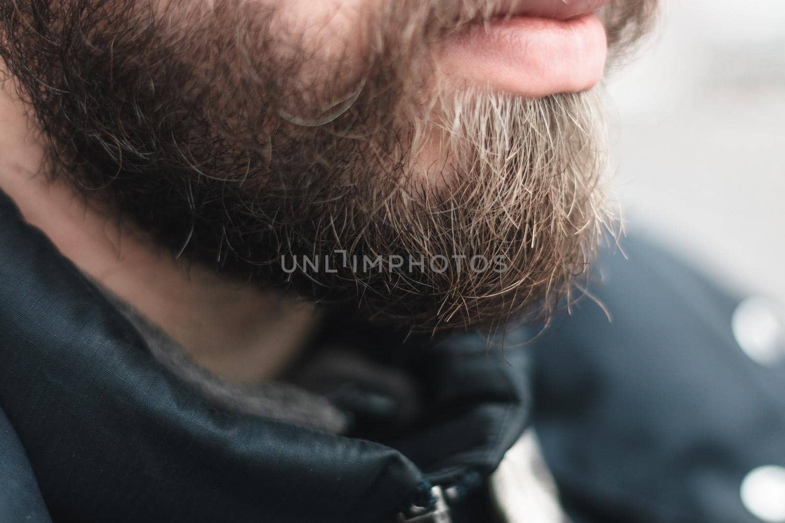 portrait of stylish young man with heavy beard by Symonenko