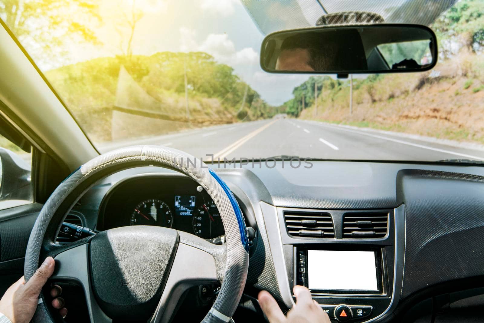 Man's hands on the wheel of the car, Close up of person driving with hands on the wheel, inside view of a man driving a car, Concept of hands on the wheel of a car