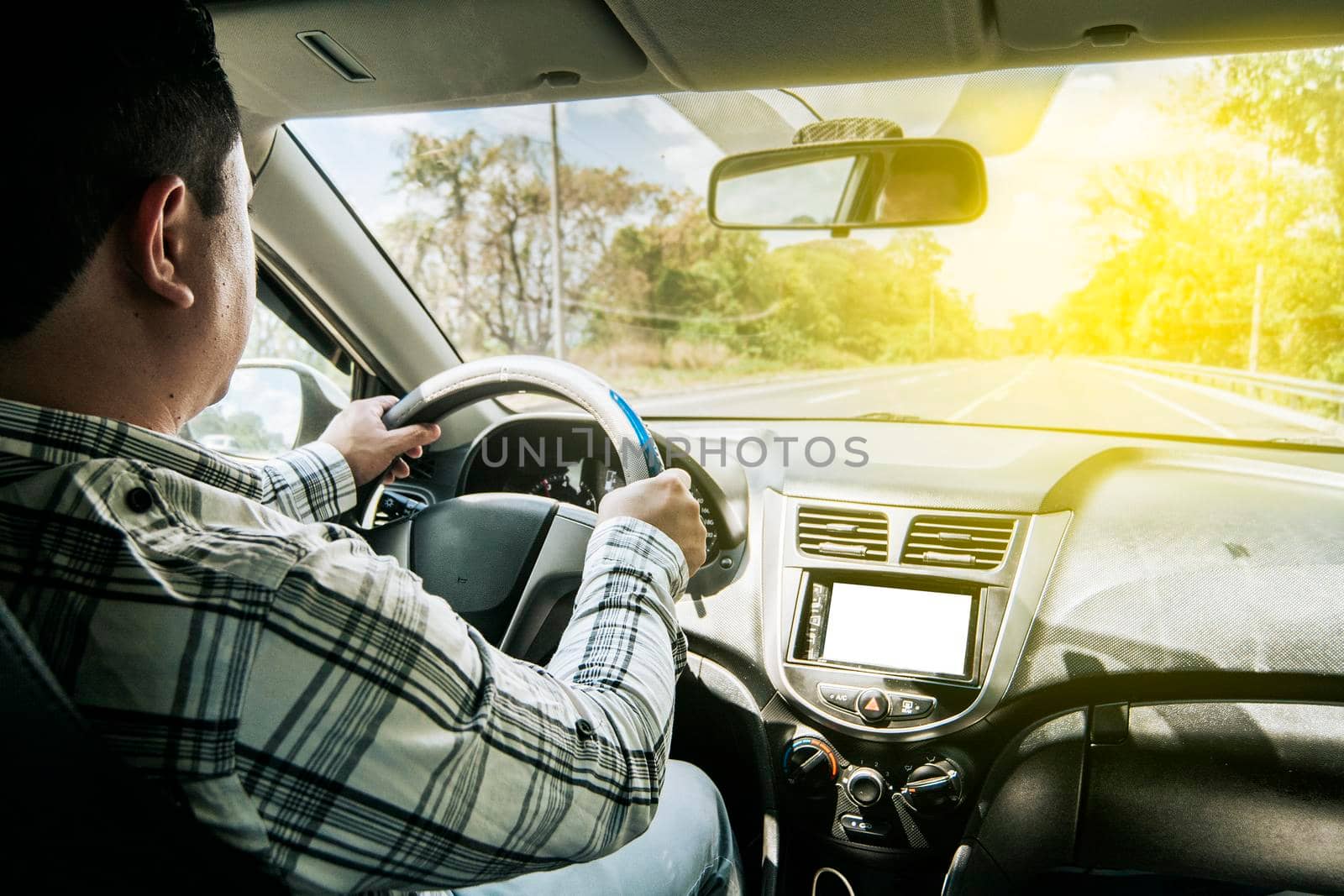 inside view of a man driving a car, A person driving with hands on the wheel, Man's hands on the wheel of the car, Concept of hands on the wheel of a car