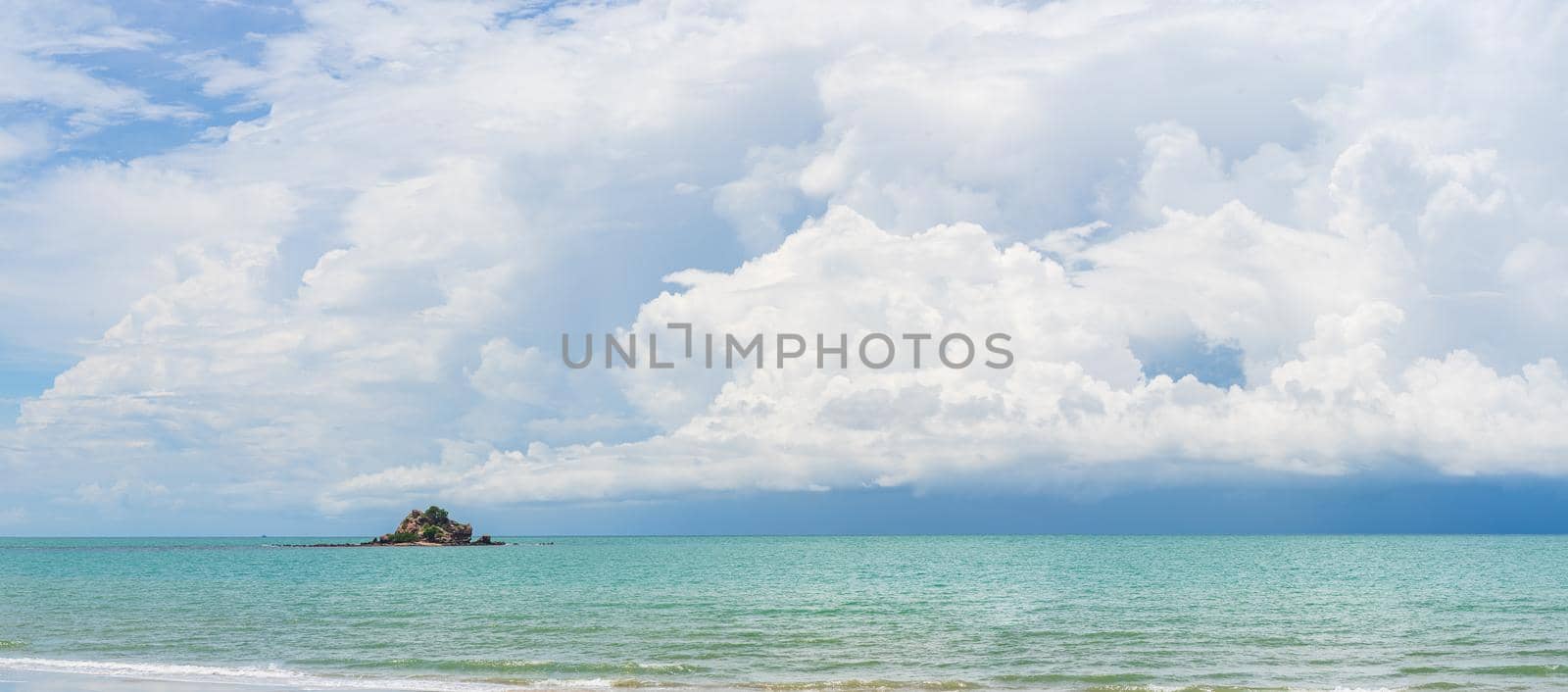 Panoramic nature landscape view of beautiful tropical beach and sea in sunny day with small island