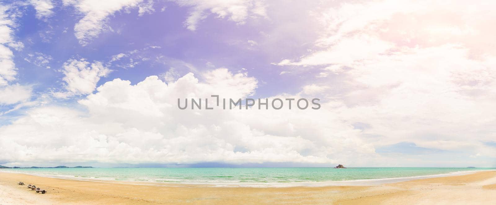 Panoramic nature landscape view of beautiful tropical beach and sea in sunny day with small island