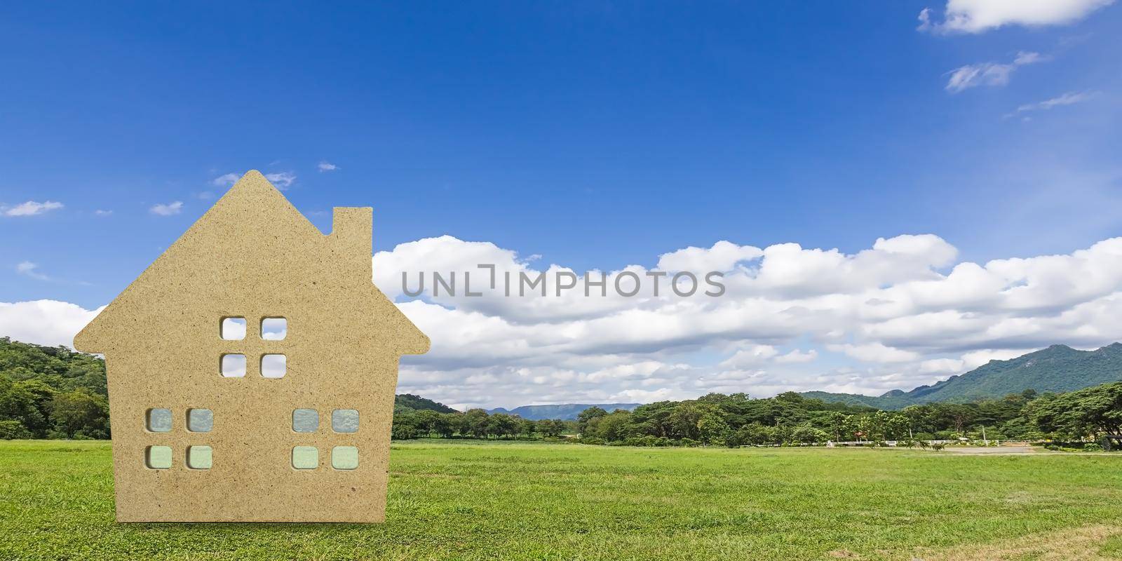 House model with landscape back background for finance and banking concept