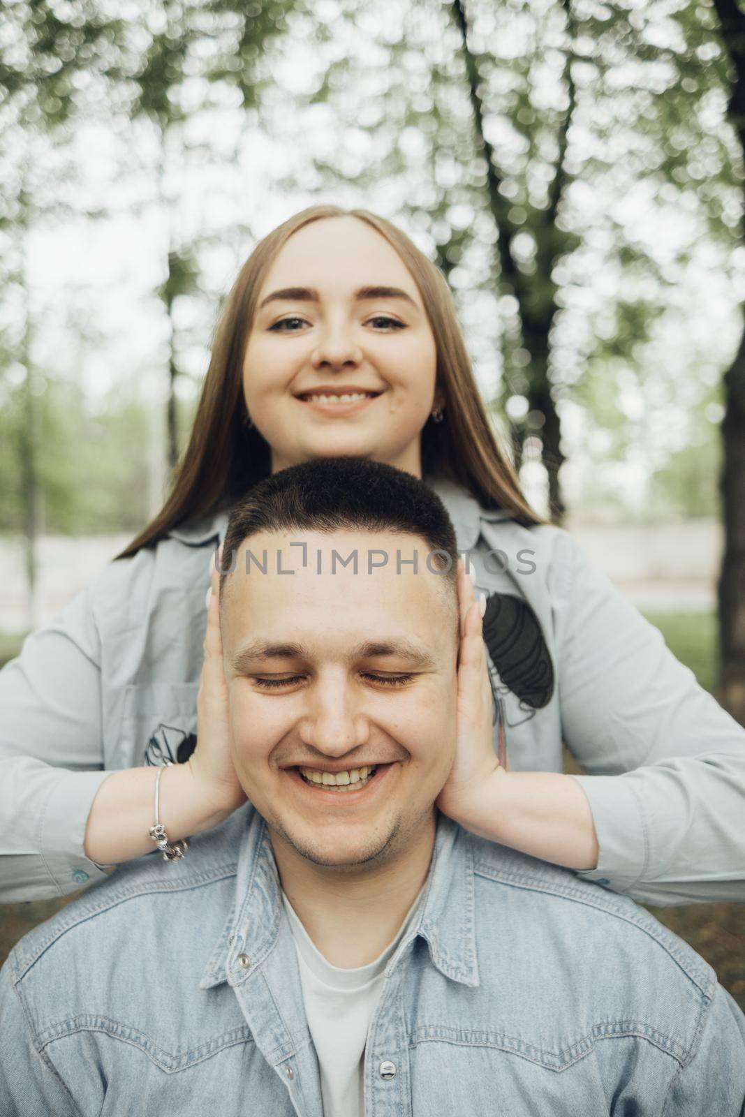 loving couple walking in ukrainian park and city