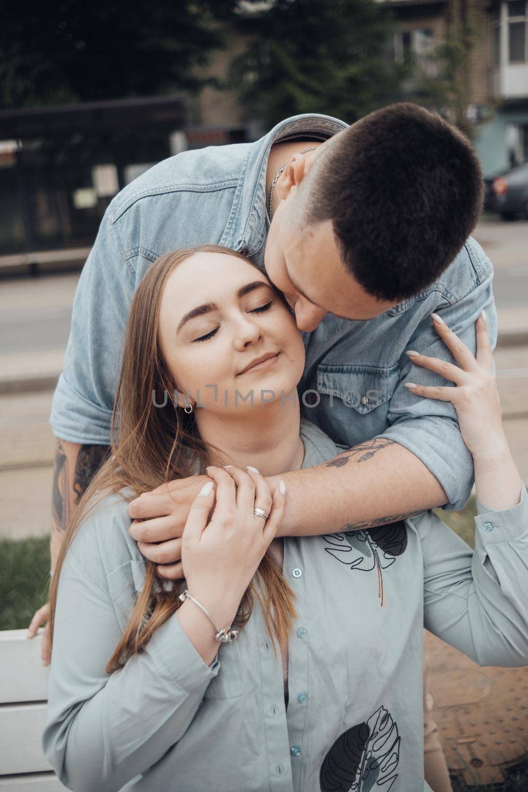 loving couple walking in ukrainian park and city