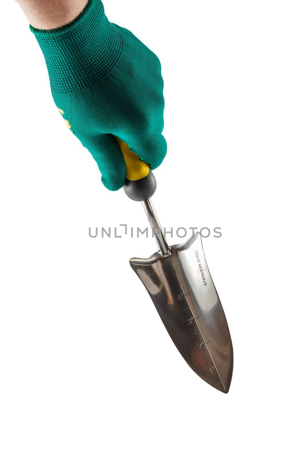 Small garden trowel in hand dressed in a green glove isolated on white