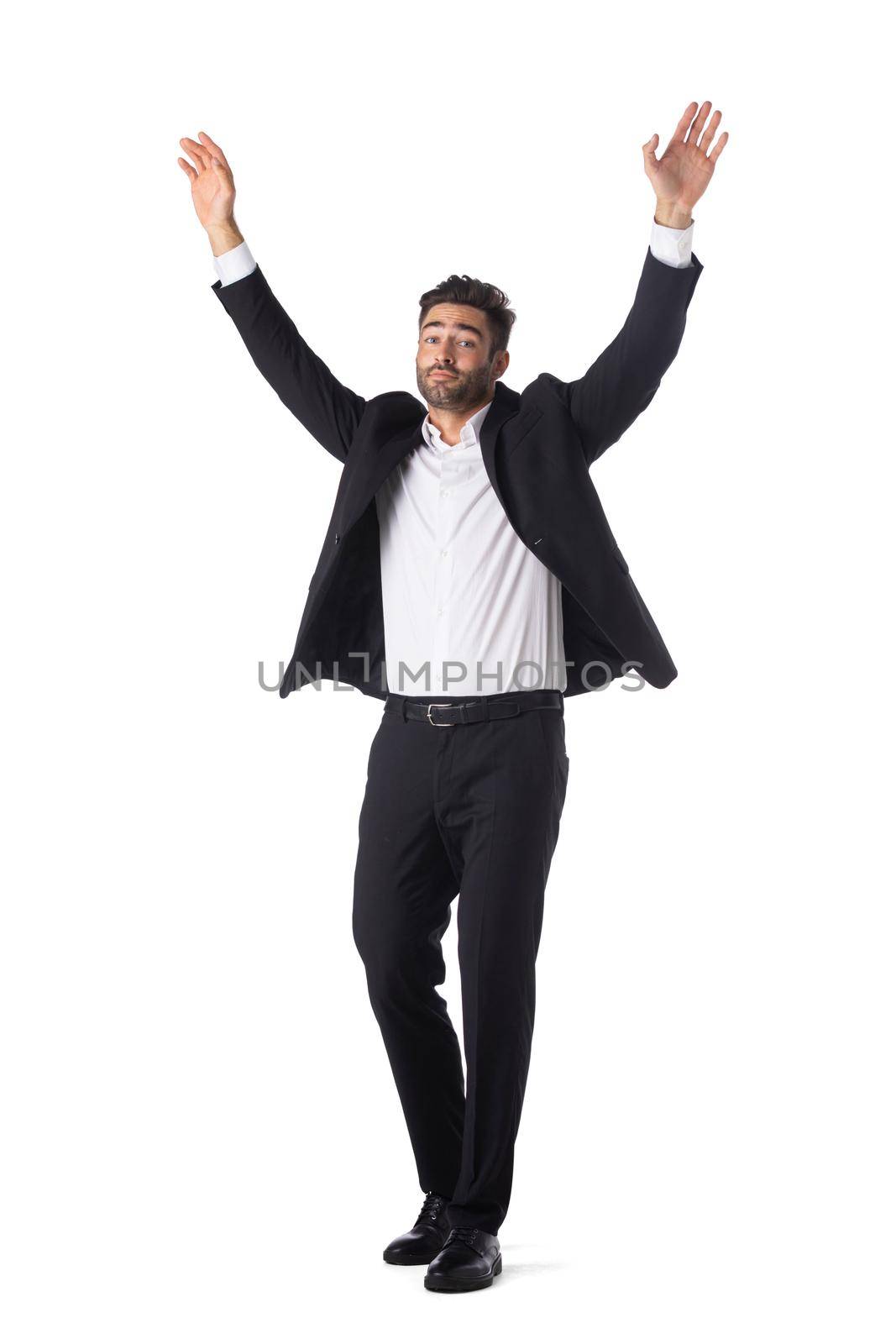 Handsome young businessman celebrating victory smiling happily with arms raised successful celebration winner emotion excitement achievement professional growth