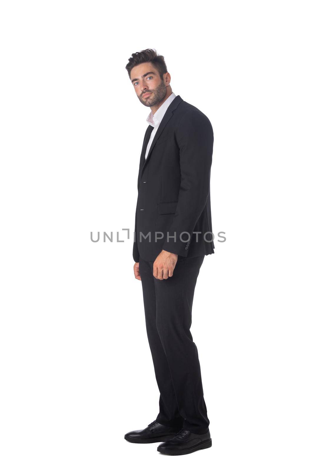 Full body of young handsome business man in black suit isolated on white background