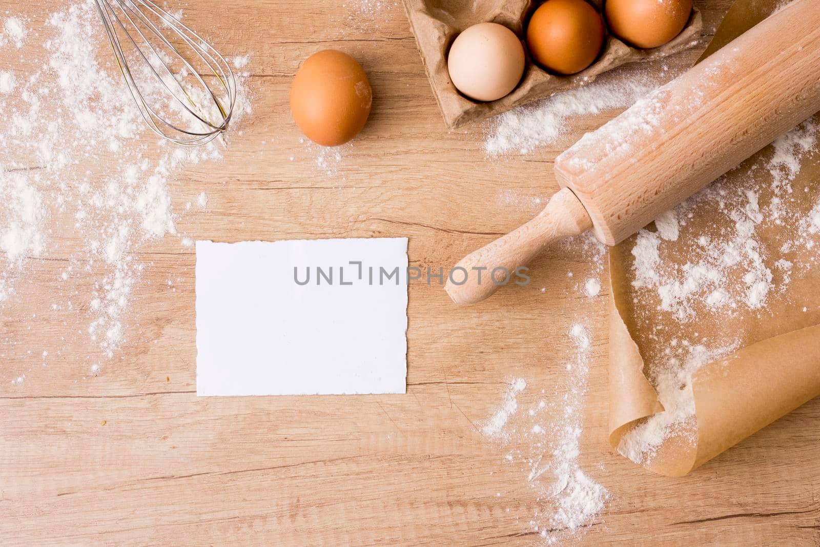 rolling pin with eggs rack paper flour