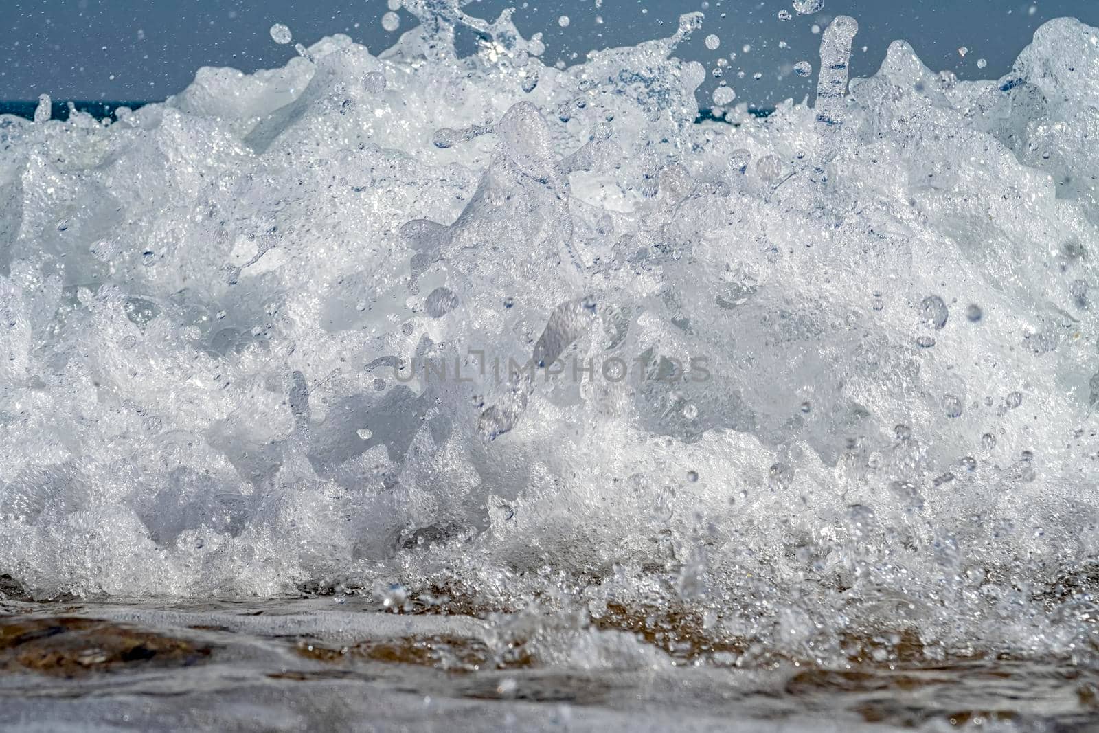 Front view of sea waves splashes. Close up