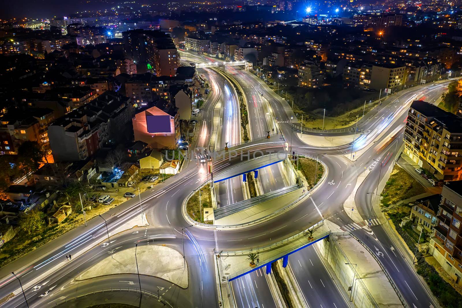 Amazing circle junction traffic road with car light movement aerial view from a drone.