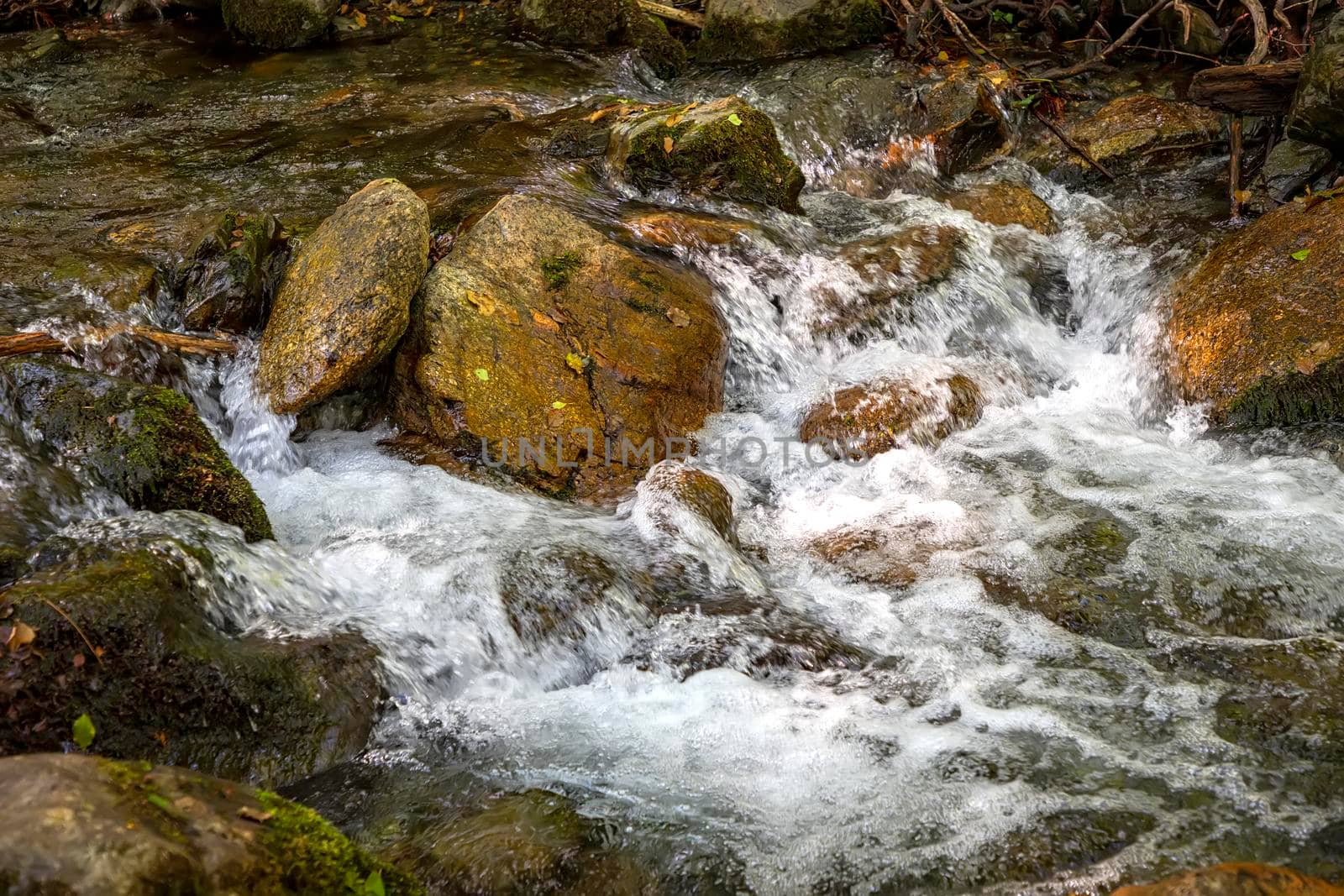 Scenic view of amazing water stream between rocks. Close up