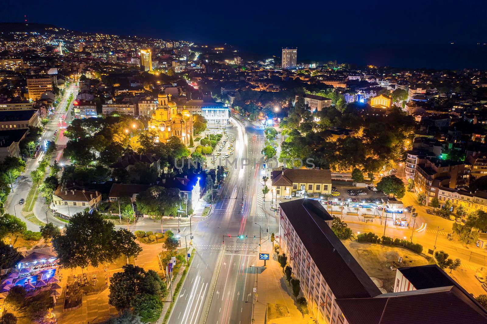 Varna, Bulgaria - October 28, 2019; Aerial view from the drone of the illuminated centrum of Varna city at night