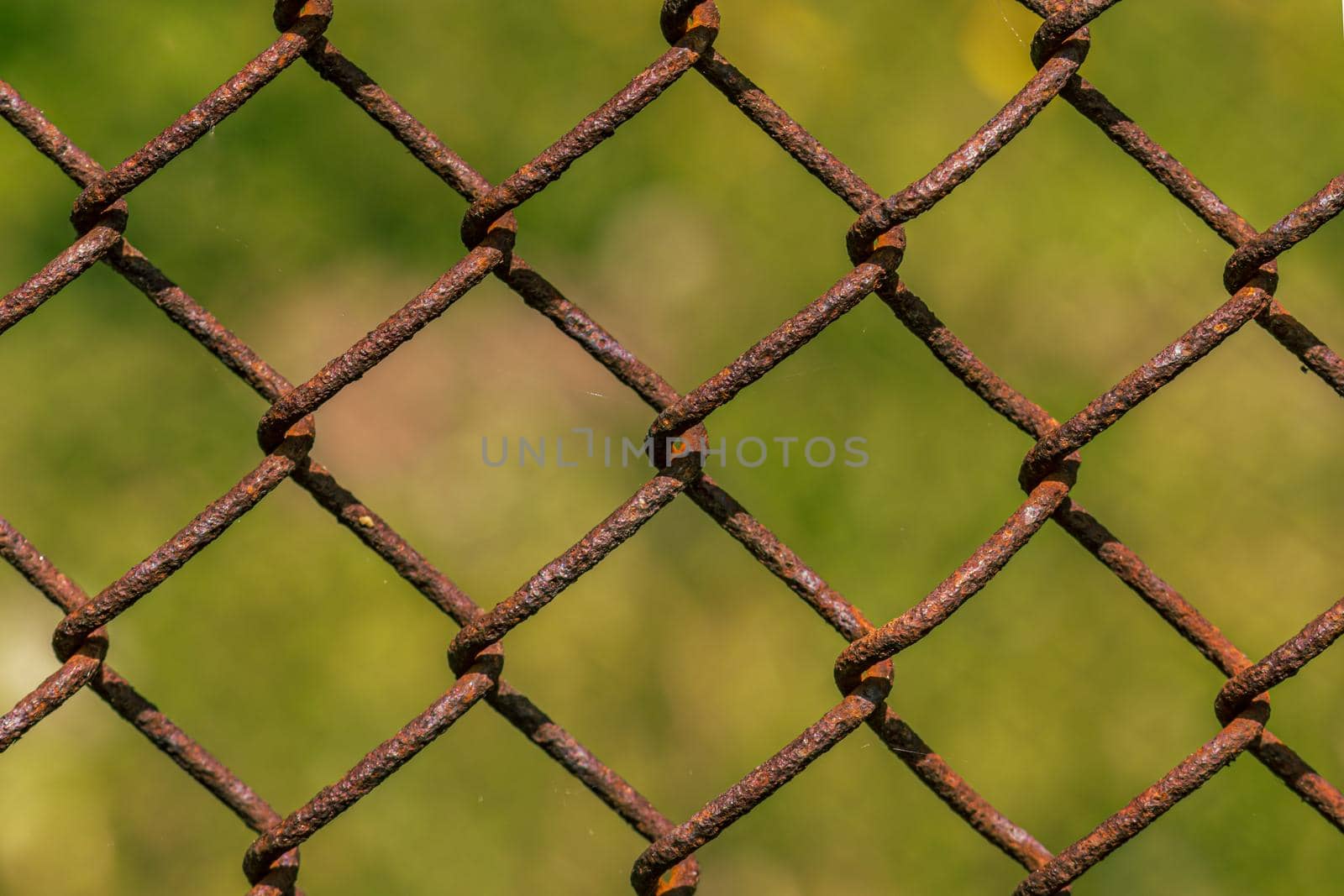 Rusty metal fence, weave close up by scudrinja