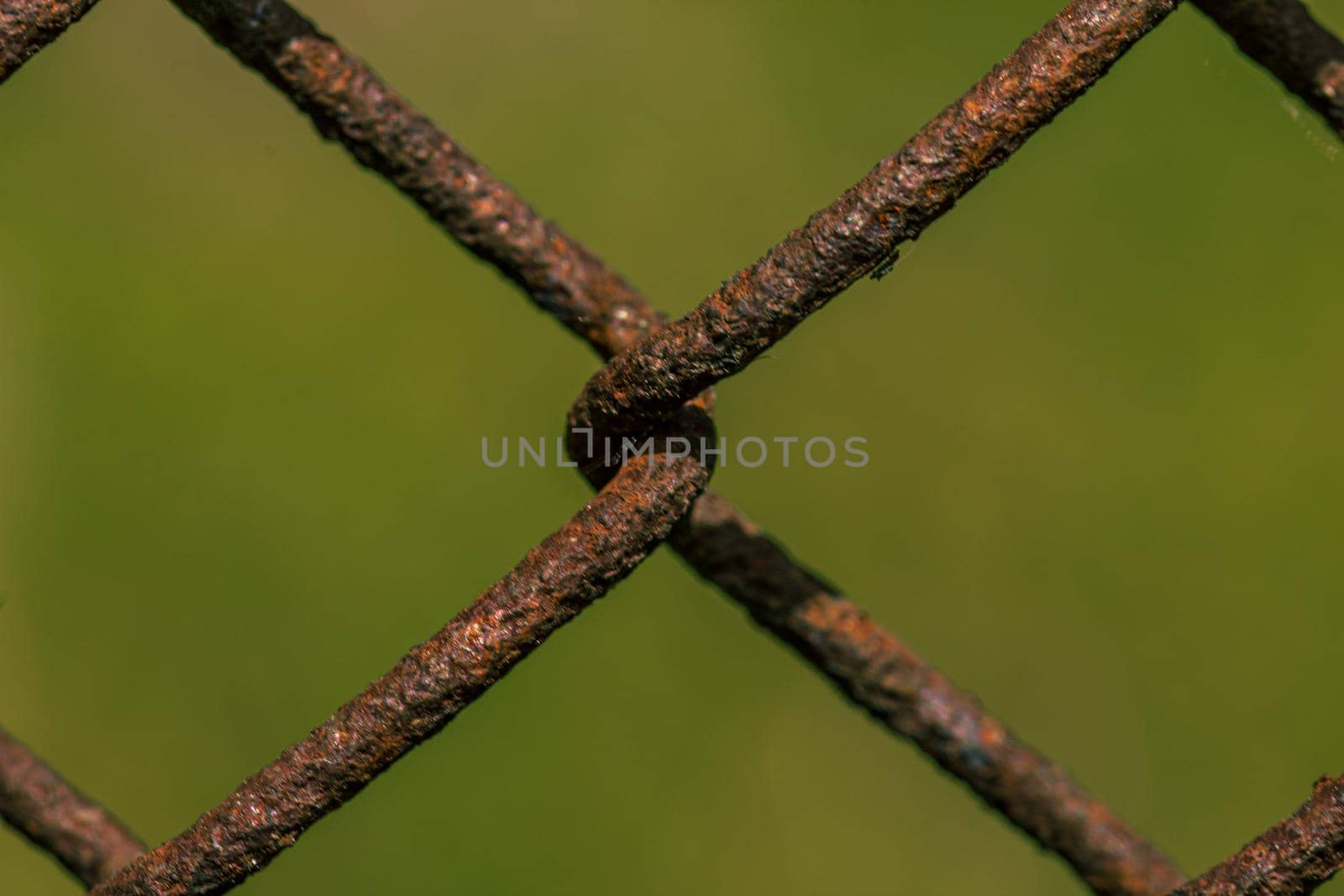 Rusty metal fence, weave close up by scudrinja