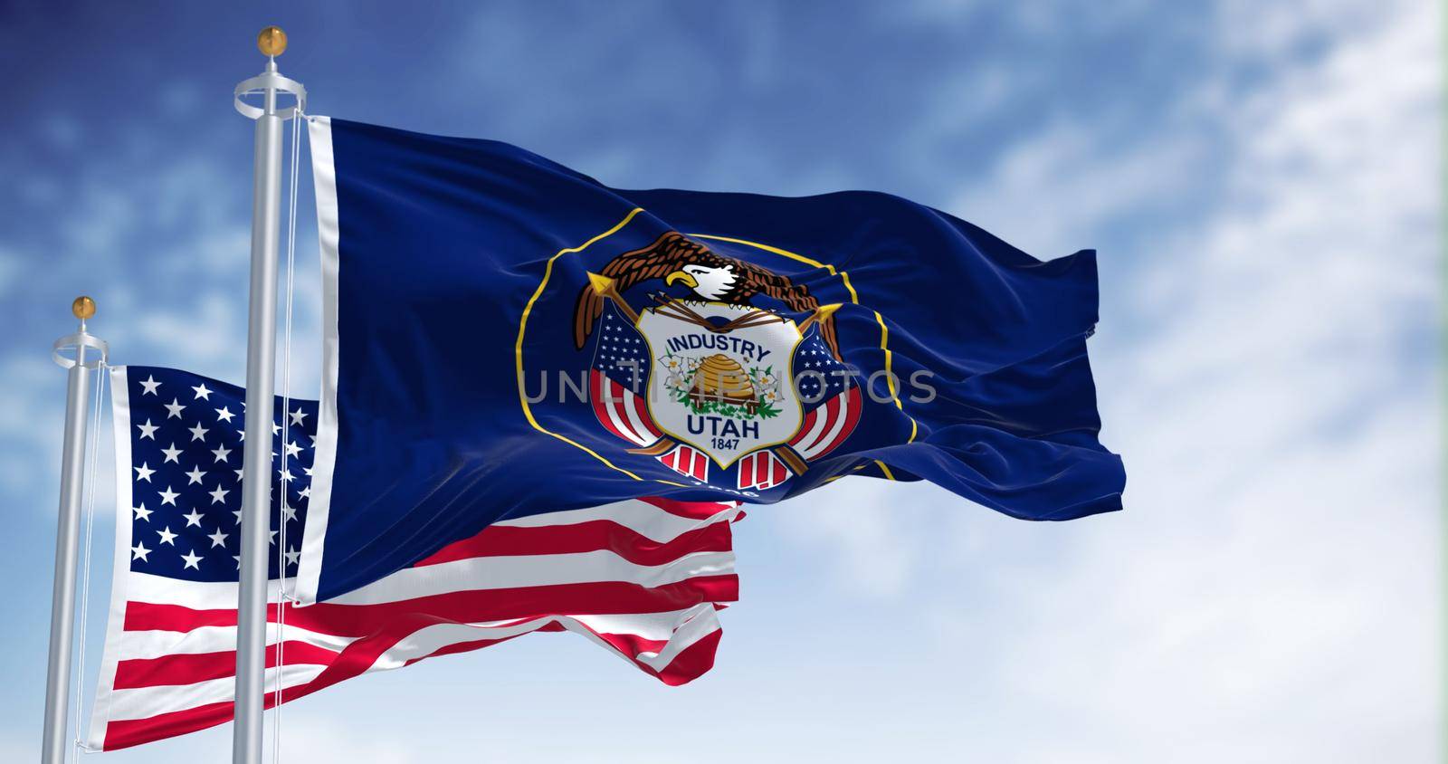 The Utah state flag waving along with the national flag of the United States of America by rarrarorro