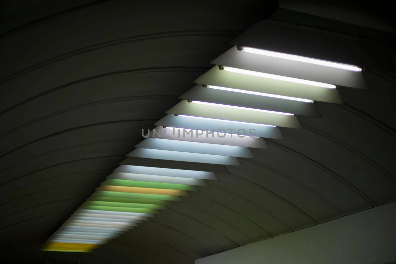 Light on ceiling. Fluorescent lamps. Interior details.