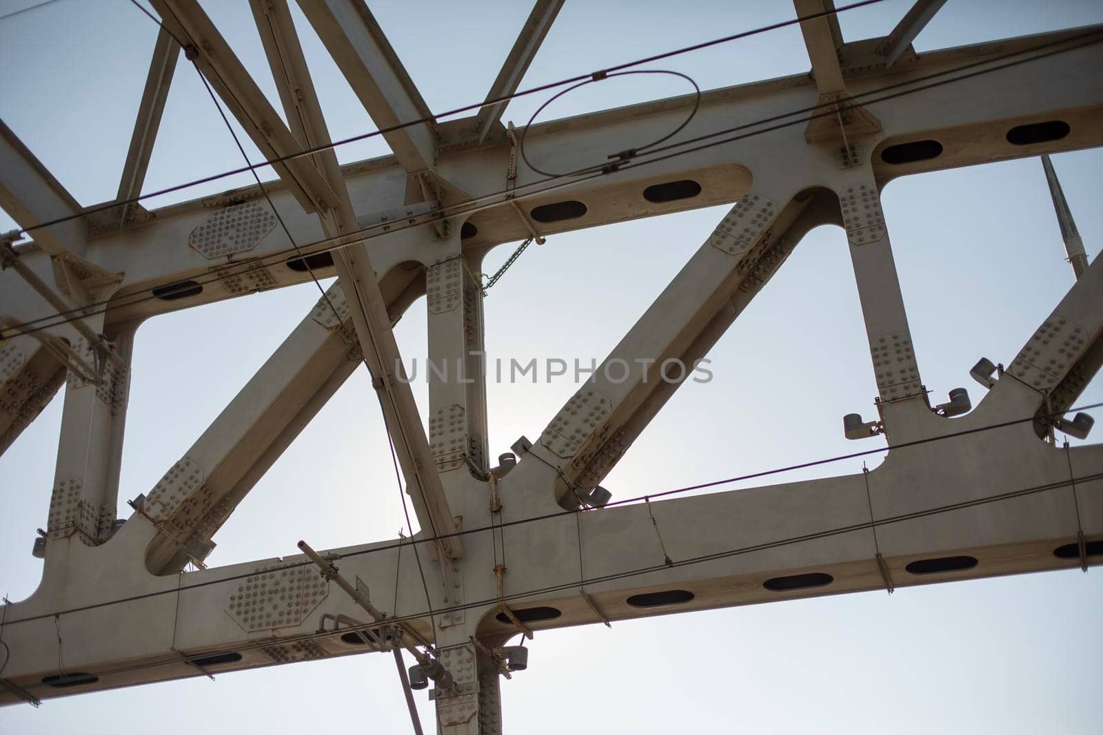 Steel bridge supports. Railway bridge is in detail. Metal construction.