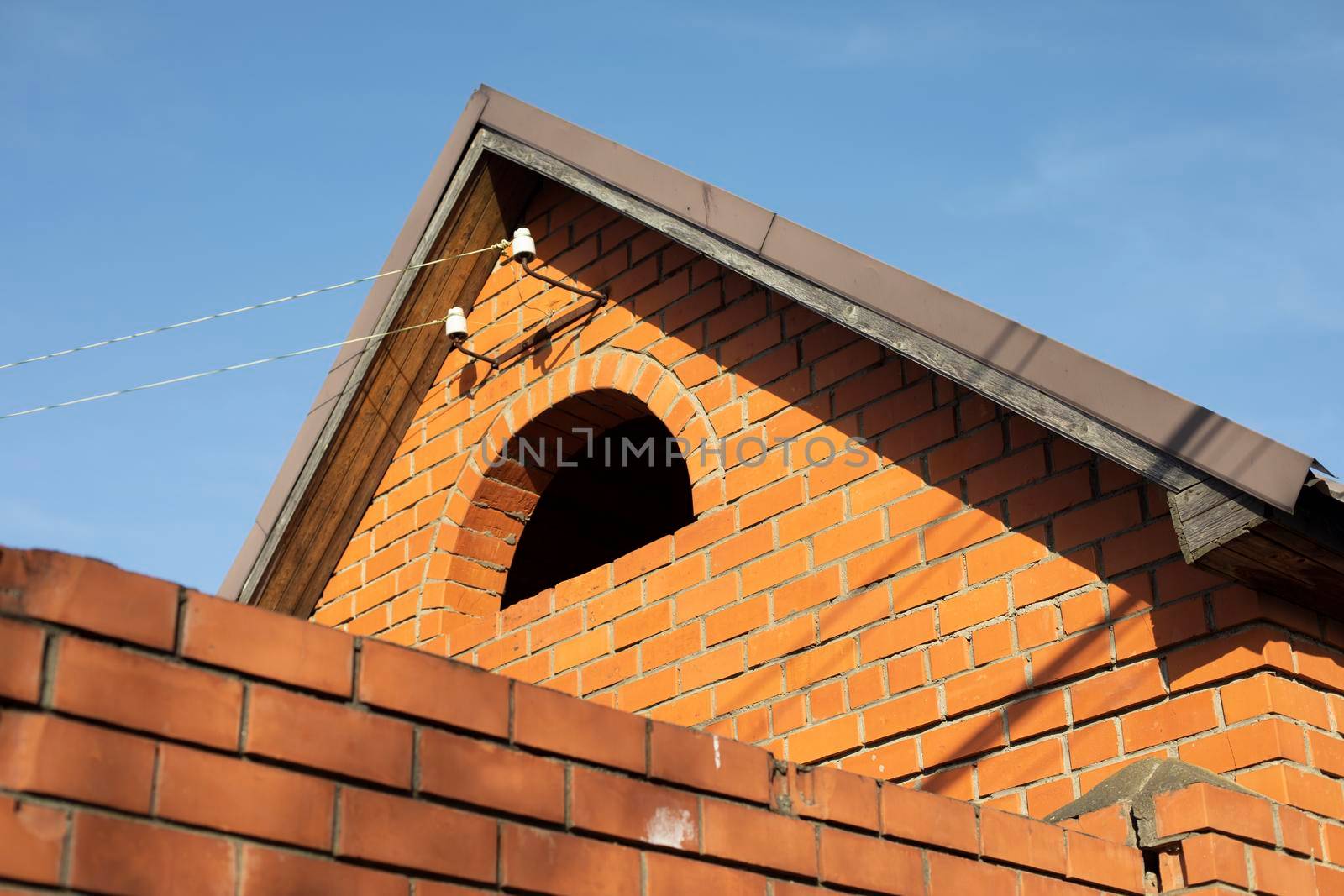 Roof of country house. Building in rural town. Village housing.