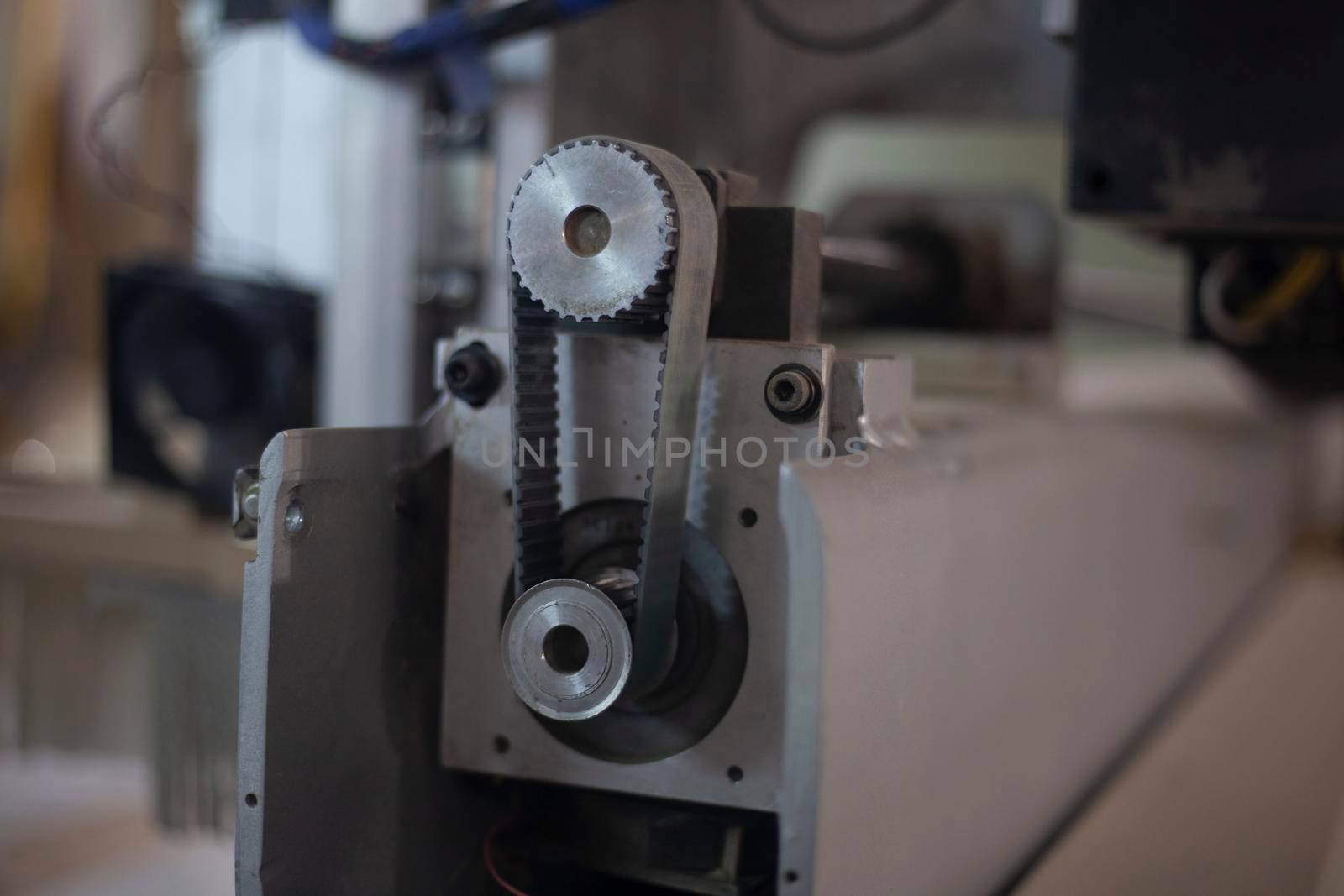 Belt on engine. Gear drive. Equipment details. CNC milling machine.
