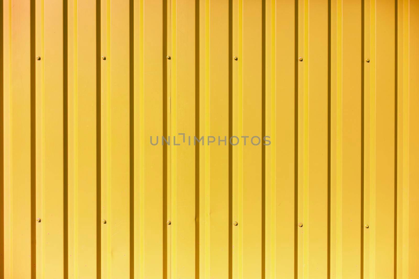 Texture of steel fence. Wall of building. Bright colors in architecture. Reflective surface.