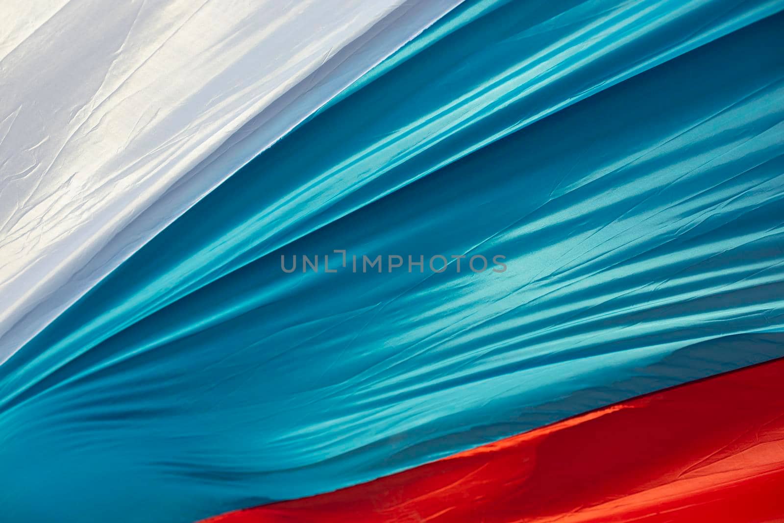 Cloth flag of Russia. Colors of national flag of Russian Federation. Three lanes.