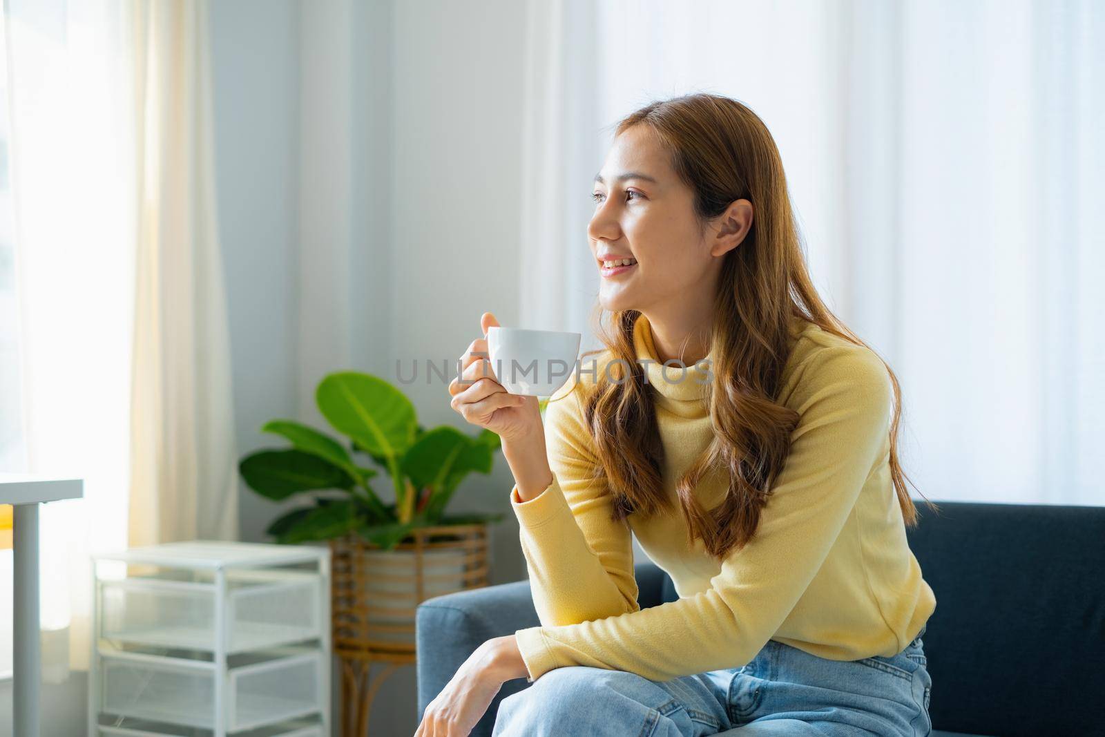 Woman enjoy coffee at morning before working at home. Business Account Finance concept