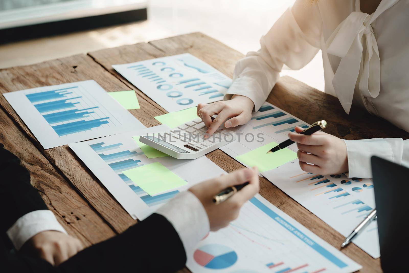 financial, Brainstorming, Data Analysis, Planning, Marketing and Accounting, Economist using calculator to calculate investment documents with partners on profit taking to compete with other companie. by Manastrong