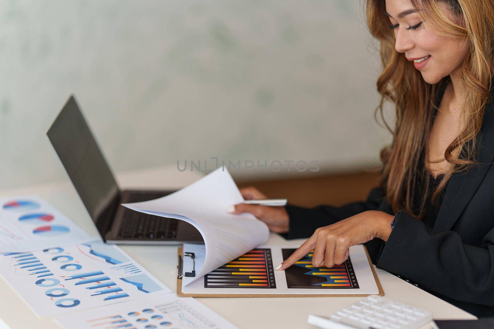 Modern Asian Business woman have confident working with financial at office. Accounting concept