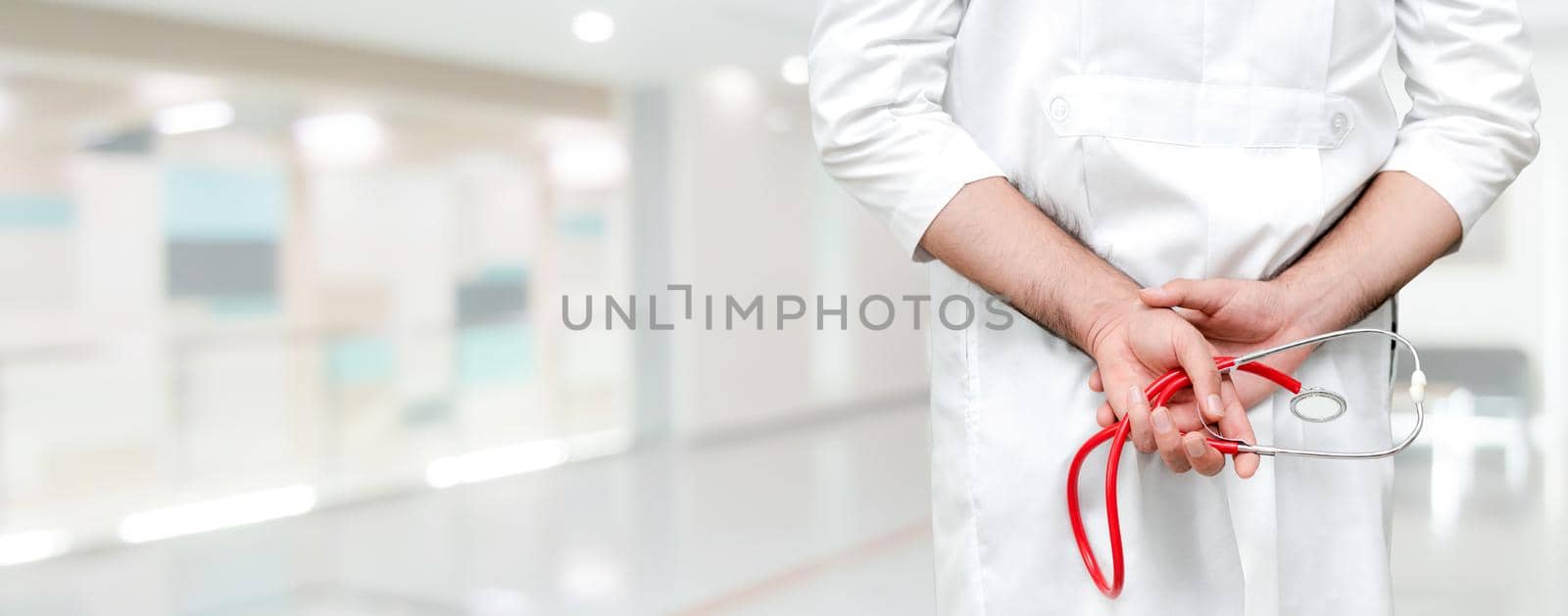 Young male doctor working at the hospital. Medical healthcare and doctor staff service.